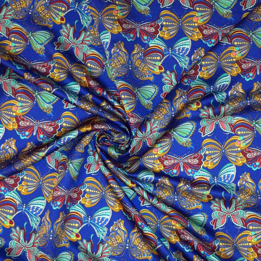 Raso lana seta imprimè – farfalle multicolor su fondo blu